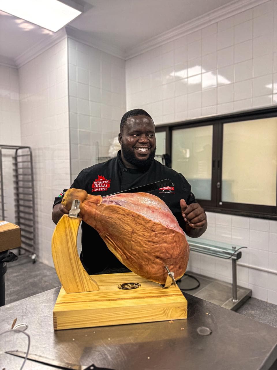 Biggy hand-carving the jamón centerpiece for the harvest table.