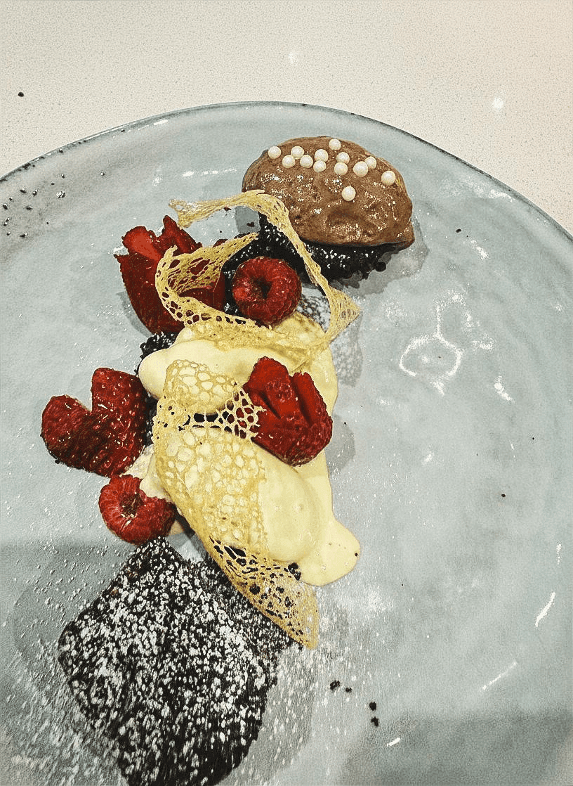 A Lindt chocolate chilli brownie with strawberries and pistachio ice cream.